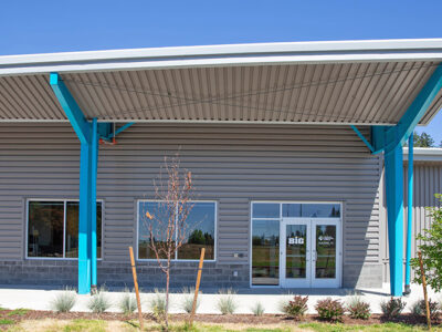 Steel college building with reverse lean-to