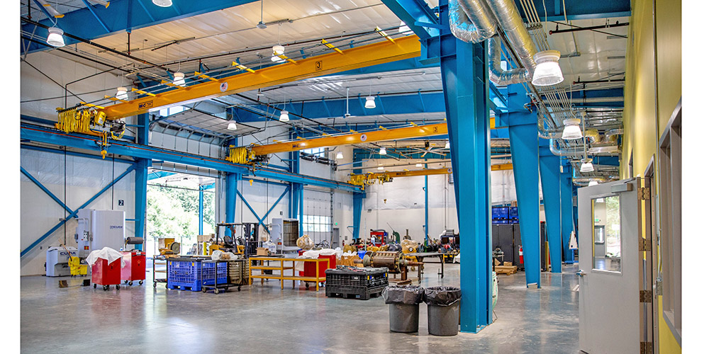 College steel building with cranes