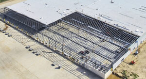 Standing seam roof installation on a steel building